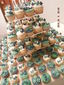 Cupcakes para XV años en azul y esmeralda